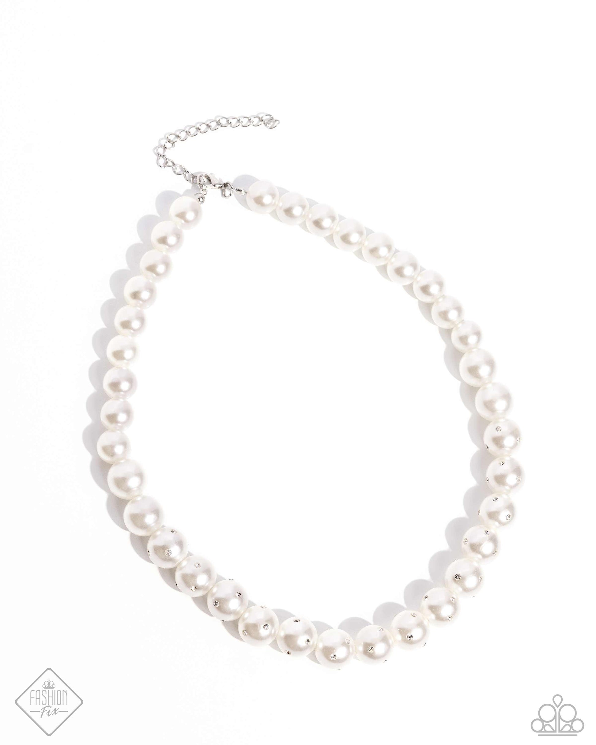 Dashing Definition White Pearl Necklace - Paparazzi Accessories  Infused along an invisible string, a collection of glossy white pearls, gradually dusted in dainty white rhinestones as it cascades towards the center of the neckline creates a radiantly, refined display. Features an adjustable clasp closure.  Sold as one individual necklace. Includes one pair of matching earrings.  P2RE-WTXX-694AY