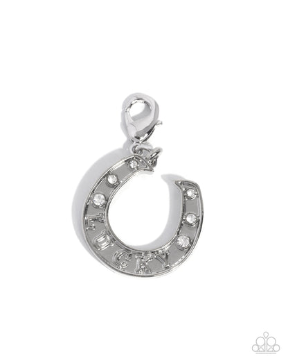 Silver horseshoe pendant with small stones on a white background
