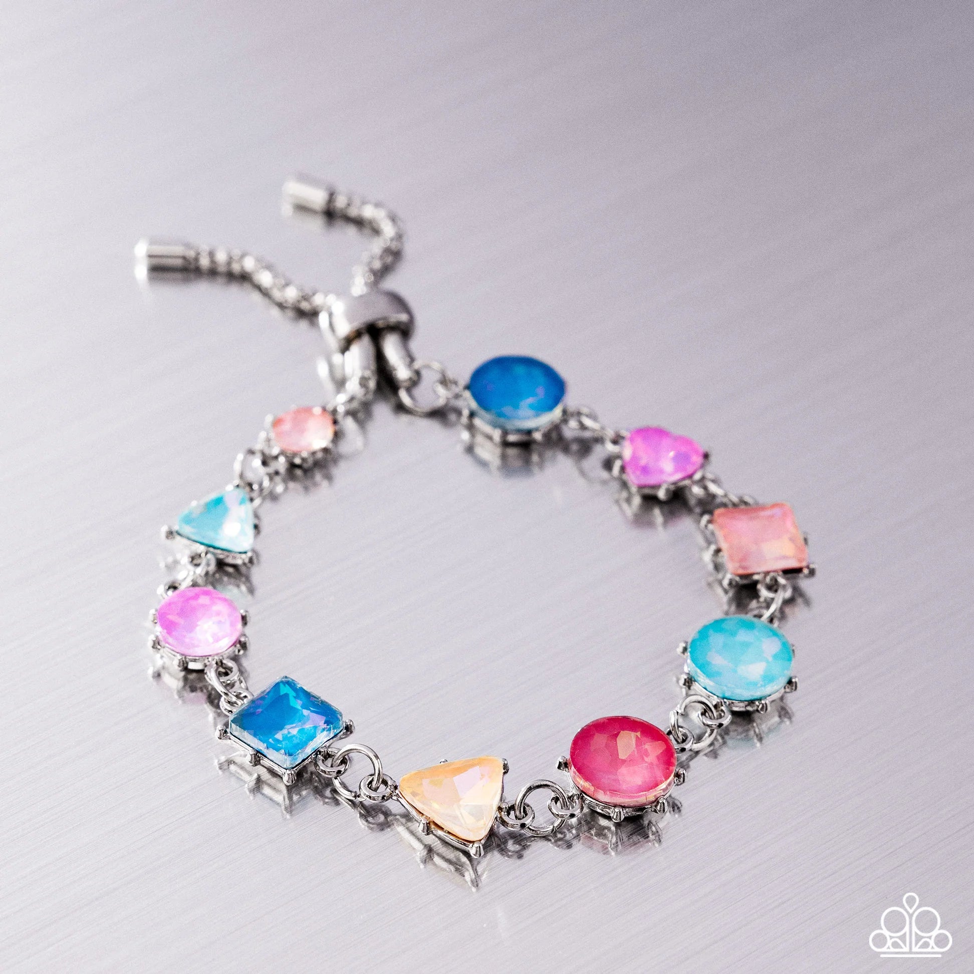 Multicolored gemstone silver bracelet on a gray background
