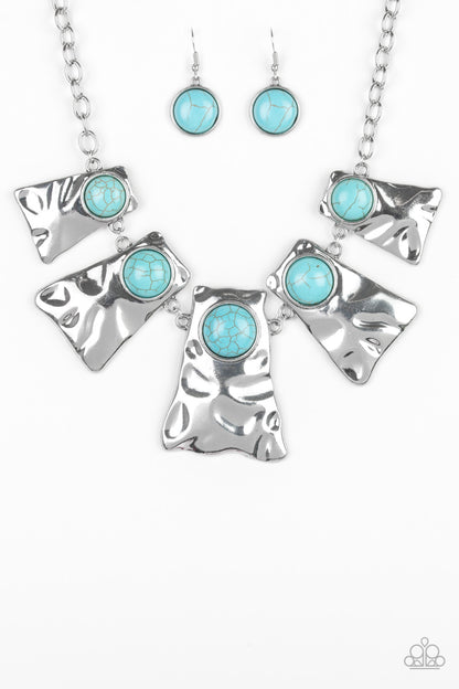 Cougar Blue Necklace - Paparazzi Accessories Item #JJG-N34 Rippling with hammered details, flared silver frames join below the collar, creating a fierce fringe. Refreshing turquoise stones are pressed into the tops of the frames for a colorful finish. Features an adjustable clasp closure. All Paparazzi Accessories are lead free and nickel free!  Sold as one individual necklace. Includes one pair of matching earrings.