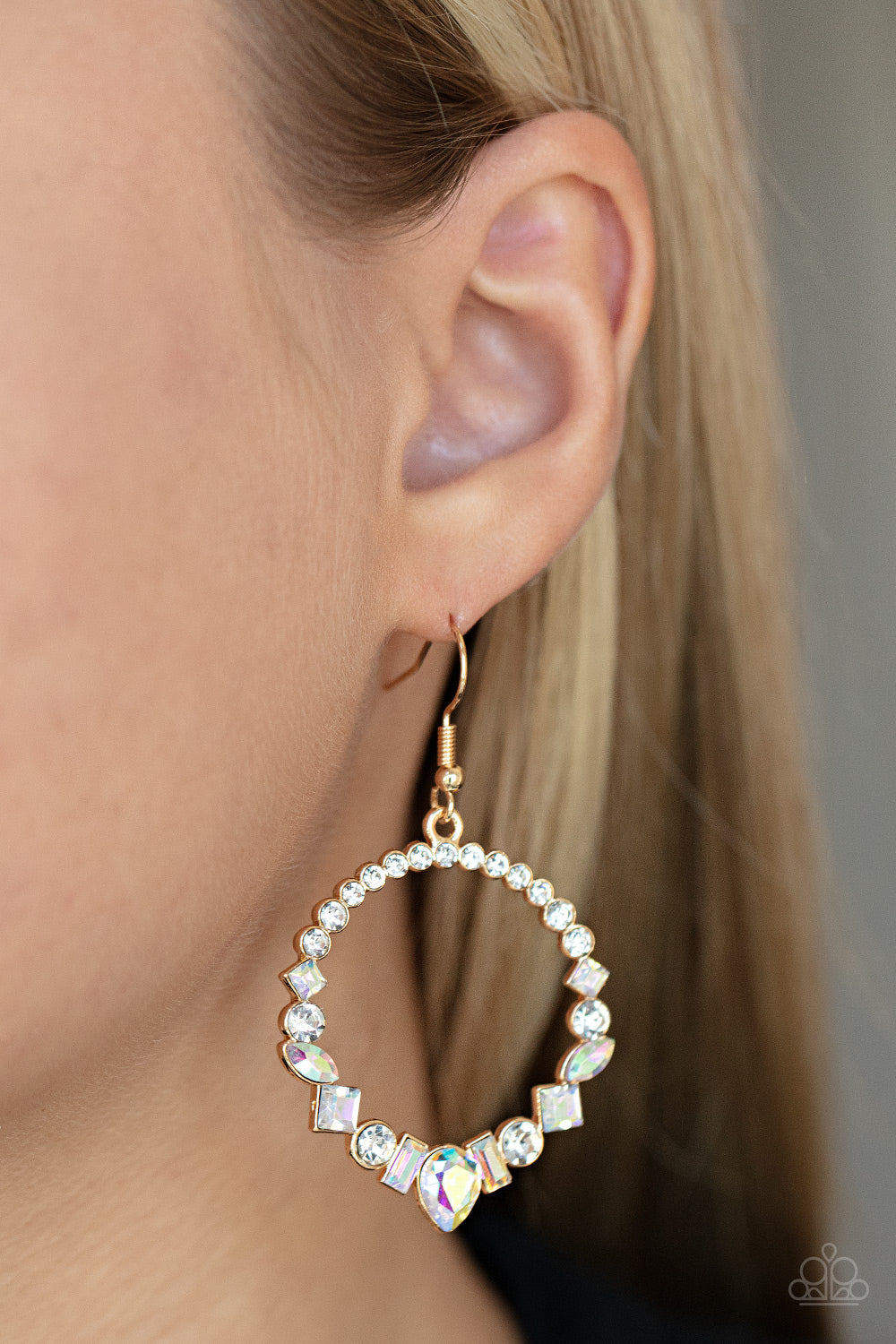 Revolutionary Refinement Gold Earring - Paparazzi Accessories  The bottom of a white rhinestone encrusted gold hoop is dotted in an intermix of classic white rhinestones and marquise and square cut iridescent gems, resulting in a stellar hoop. Earring attaches to a standard fishhook fitting.  Sold as one pair of earrings.