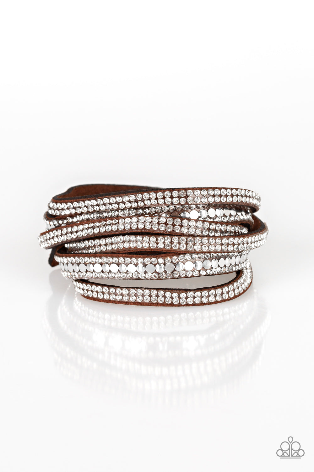 Rock Star Attitude Brown Wrap Bracelet - Paparazzi Accessories  Encrusted in rows of glassy white rhinestones and flat silver studs, three strands of brown suede wrap around the wrist for a sassy look. The elongated band allows for a trendy double wrap around the wrist. Features an adjustable snap closure.  Sold as one individual bracelet.