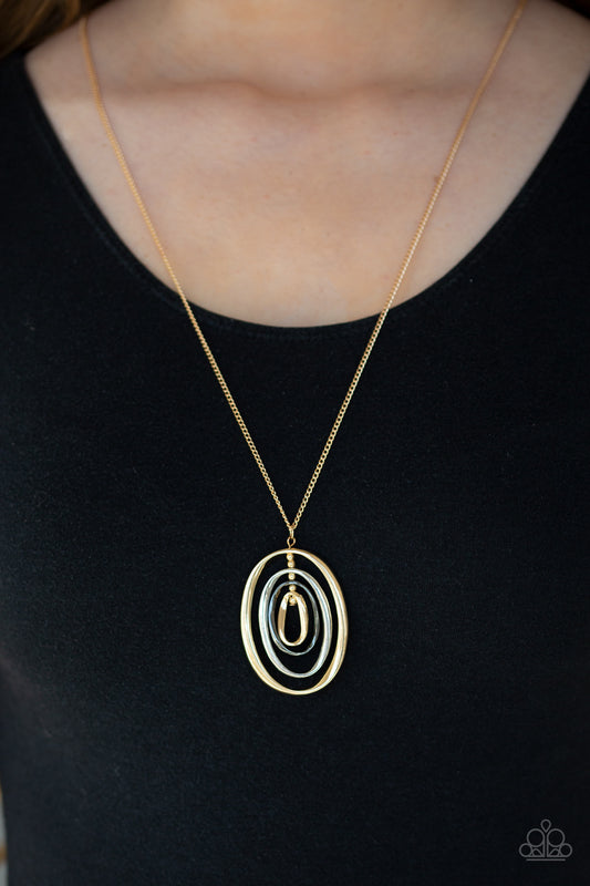 Classic Convergence - Gold Item #N763 Threaded along a gold-beaded rod, mismatched gold, silver, and gunmetal ovals ripple into a dizzying pendant at the bottom of a lengthened gold chain. Features an adjustable clasp closure. All Paparazzi Accessories are lead free and nickel free!  Sold as one individual necklace. Includes one pair of matching earrings.