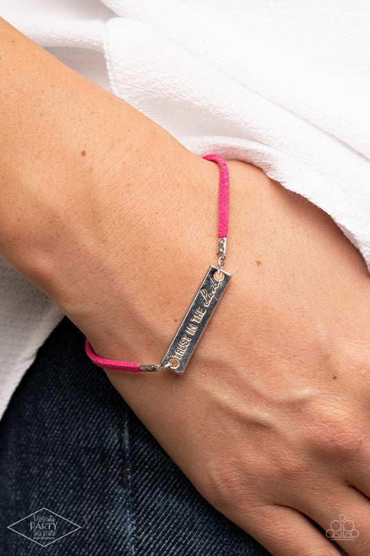 Have Faith Pink Bracelet - Paparazzi Accessories  A strip of pink suede wraps around the wrist, joining a silver plate engraved with the phrase “Trust In The Lord” for an inspirational finish. Features an adjustable clasp closure.  Sold as one individual bracelet. This Fan Favorite is back in the spotlight at the request of our 2021 Life of the Party member with Black Diamond Access, Brooke H.