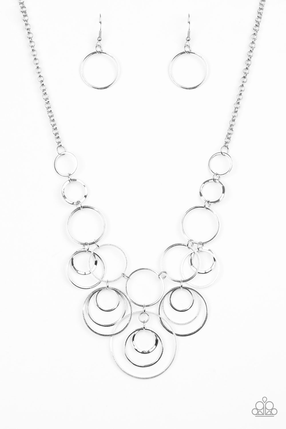 Break The Cycle - Silver Item #N728 Featuring smooth and delicately hammered finishes, mismatched silver hoops connect below the collar for a bold industrial look. Features an adjustable clasp closure. All Paparazzi Accessories are lead free and nickel free!  Sold as one individual necklace. Includes one pair of matching earrings.