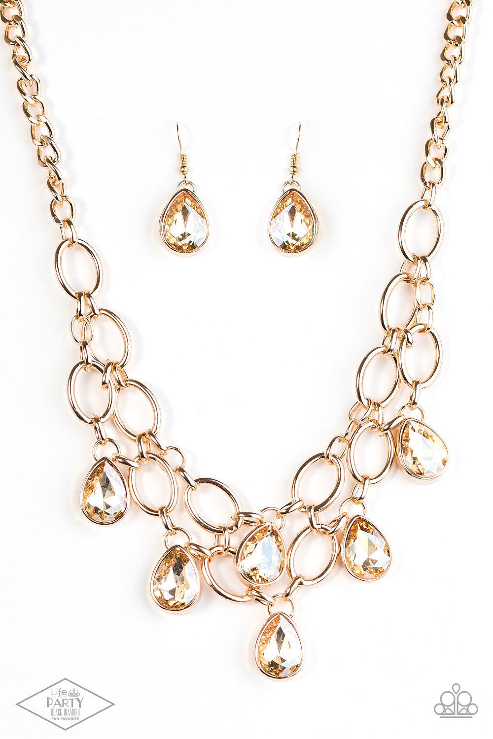 Show-Stopping Shimmer Gold Necklace - Paparazzi Accessories  Joined by dainty gold links, two rows of dramatic gold chain layer below the collar in a fierce fashion. Golden teardrops drip from the glistening layers, adding a timeless shimmer to the show-stopping piece. Features an adjustable clasp closure.  Includes one pair of matching earrings. This Fan Favorite is back in the spotlight at the request of our 2021 Life of the Party member with Black Diamond Access, Shayla S.