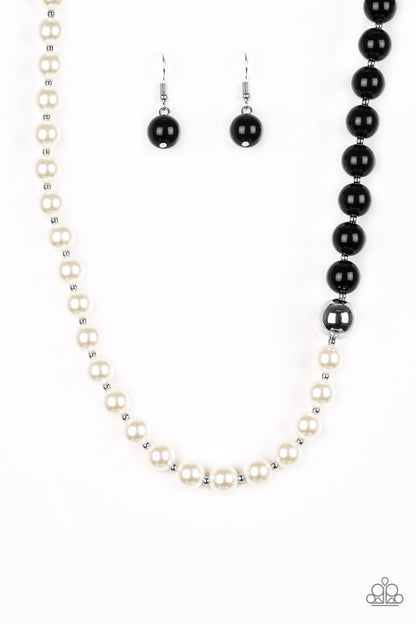 5th Avenue A-Lister Black Necklace - Paparazzi Accessories Separated by dainty silver beads, classic white pearls merge into shiny black beads for a contemporary look. Infused with a shiny silver bead, the timeless pearls and beads collect below the collar for a refined asymmetrical look. Features an adjustable clasp closure.   Sold as one individual necklace. Includes one pair of matching earrings.