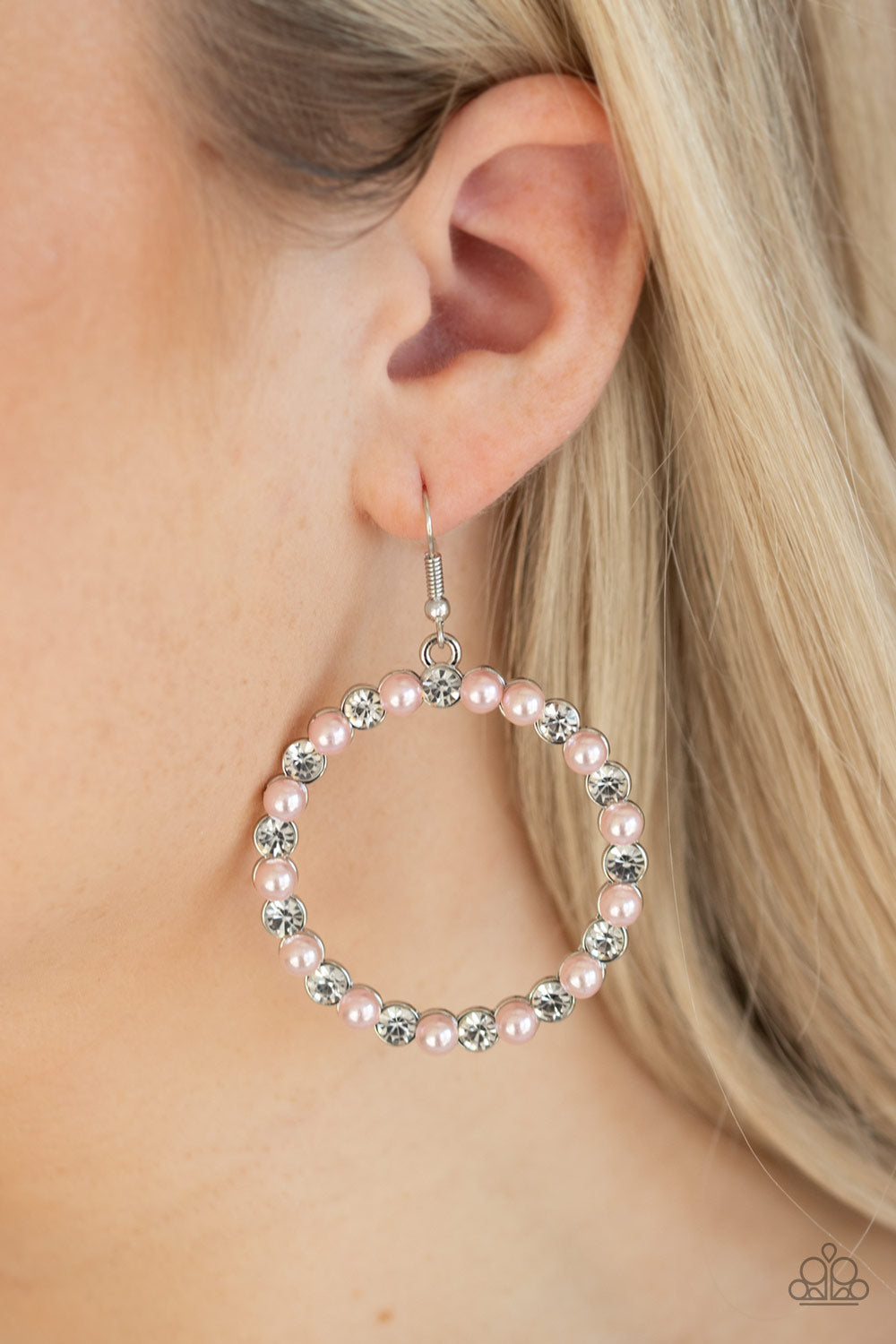 Pearl Palace - Pink Bubbly pink pearls and glassy white rhinestones alternate along the front of a shimmery silver hoop for a timeless look. Earring attaches to a standard fishhook fitting. All Paparazzi Accessories are lead free and nickel free!  Sold as one pair of earrings.