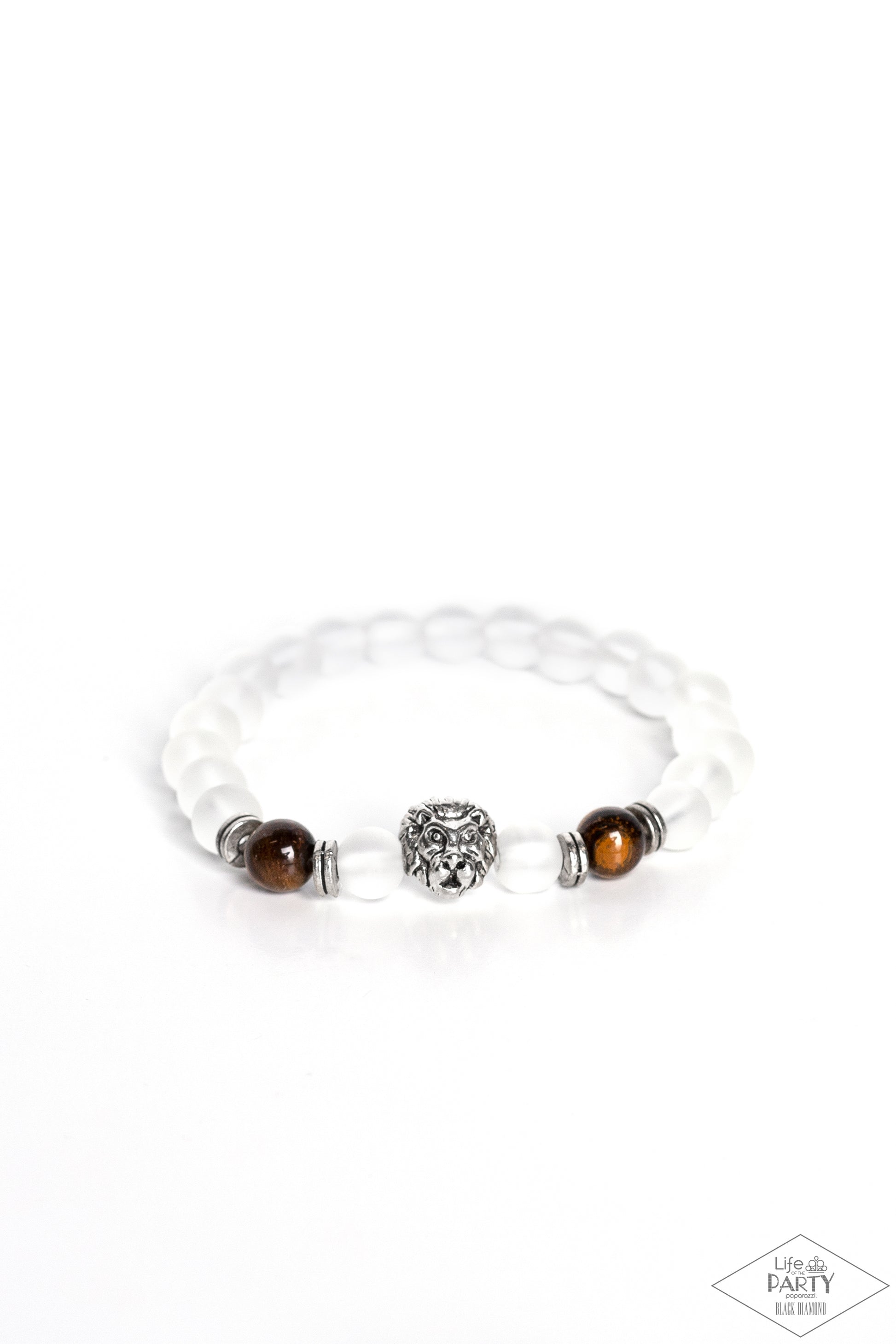 The Lions Share Brown Bracelet - Paparazzi Accessories  Infused with a silver lion charm, glassy white and energetic tiger's eye stones are threaded along a stretchy elastic band for a seasonal look.  Sold as one individual bracelet.  P9SE-URBN-269XX. This Black Diamond Encore is back in the spotlight at the request of our 2022 Life of the Party member with Black Diamond Access, Monica Cox