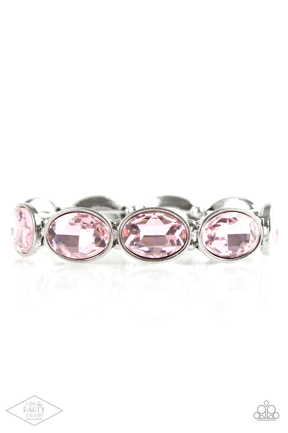 DIVA In Disguise Pink Bracelet - Paparazzi Accessories  Glassy pink gems are pressed into sleek silver frames. Infused with dainty silver beads, the glittery frames are threaded along stretchy elastic bands for a glamorous look around the wrist.  Sold as one individual bracelet. This Fan Favorite is back in the spotlight at the request of our 2021 Life of the Party member with Black Diamond Access, Valerie H.