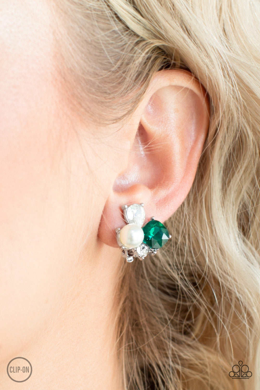 Highly High-Class Green Clip-On Earring - Paparazzi Accessories  Featuring a classic pearl, mismatched green and white rhinestones join into a radiant frame. Earring attaches to a standard clip-on fitting. All Paparazzi Accessories are lead free and nickel free!  Sold as one pair of clip-on earrings.