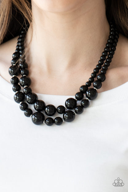The More The Modest Black Necklace - Paparazzi Accessories   Infused with dainty silver accents, shiny black beads layer below the collar in a timeless fashion. Features an adjustable clasp closure.  Sold as one individual necklace. Includes one pair of matching earrings.