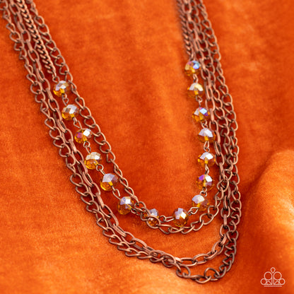 Extravagant Elegance Copper Necklace - Paparazzi Accessories  Mismatched copper chains layer down the chest. Dipped in a coppery metallic sheen, a strand of faceted black beads join below the collar for a glamorous look. Features an adjustable clasp closure.  Sold as one individual necklace. Includes one pair of matching earrings.