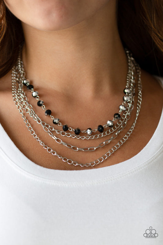 Extravagant Elegance Multi Necklace - Paparazzi Accessories  Mismatched silver chains layer down the chest. Dipped in a metallic sheen, a strand of faceted black beads joins below the collar for a glamorous look. Features an adjustable clasp closure.  All Paparazzi Accessories are lead free and nickel free!  Sold as one individual necklace. Includes one pair of matching earrings.