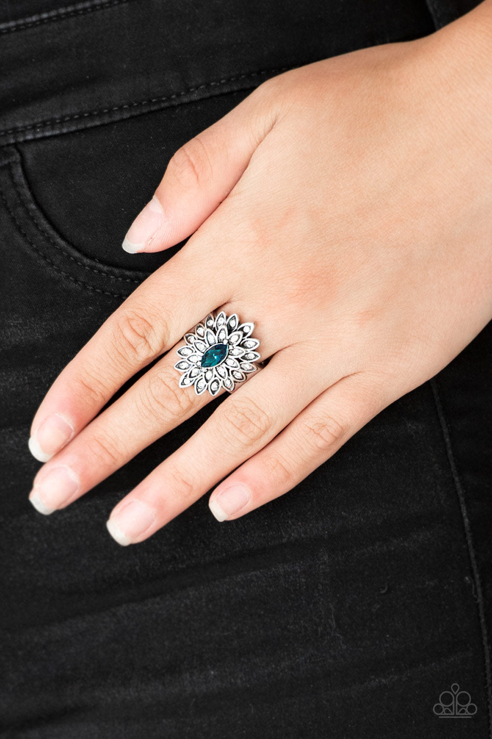 Blooming Fireworks Blue Ring - Paparazzi Accessories  Dotted in dainty white rhinestones, silver petals radiate from a regal blue marquise shaped rhinestone center for an edgy look. Features a stretchy band for a flexible fit.   Sold as one individual ring.