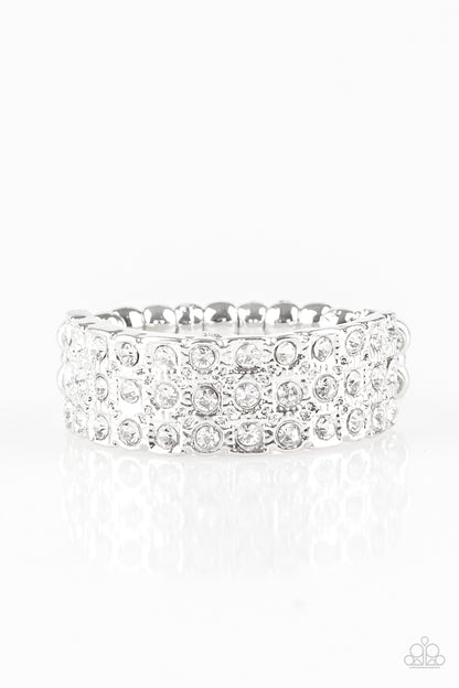 Feeling Fab-YOU-less White Ring - Paparazzi Accessories  Row after row of dazzling white rhinestones are encrusted along a dainty silver band, creating timeless shimmer. Features a dainty stretchy band for a flexible fit.  All Paparazzi Accessories are lead free and nickel free!   Sold as one individual ring.