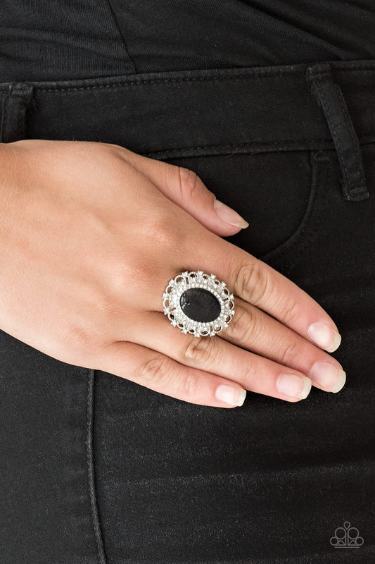 BAROQUE The Spell - Black Item #P4RE-BKXX-180XX Encrusted in dainty white rhinestones, a frilly silver frame spins around a glowing black moonstone center for a regal look. Features a stretchy band for a flexible fit.  Sold as one individual ring.