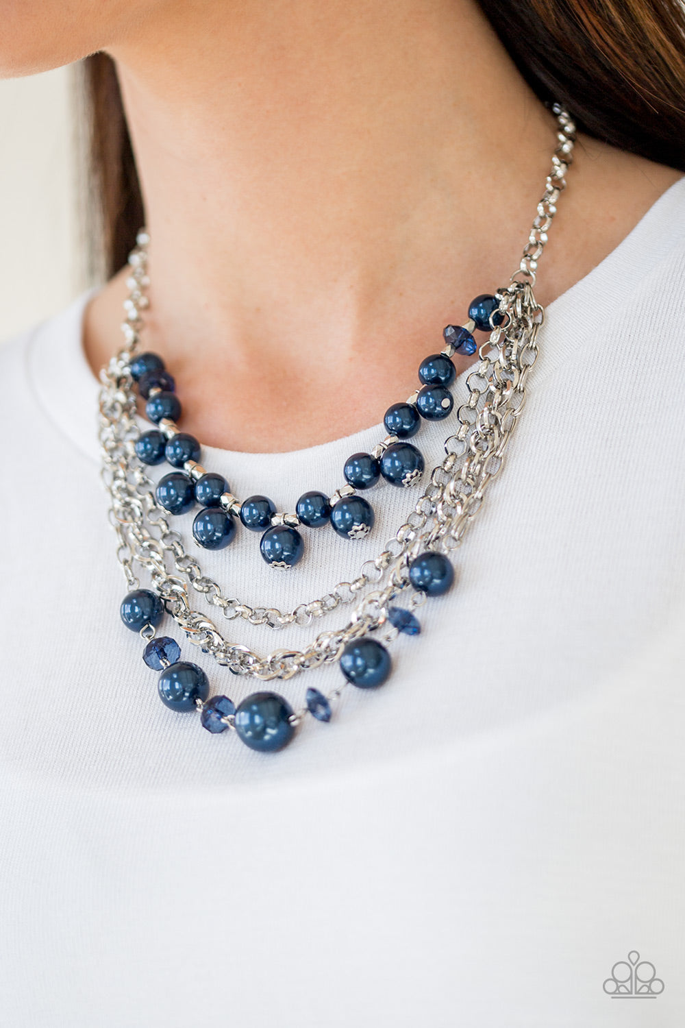 Rockin Rockette - Blue Item #P2ST-BLXX-023XX Varying in size, blue pearls, blue crystal-like beads, and faceted silver beads join with mismatched silver chains below the collar, creating a radically refined fringe. Features an adjustable clasp closure.  Sold as one individual necklace. Includes one pair of matching earrings.