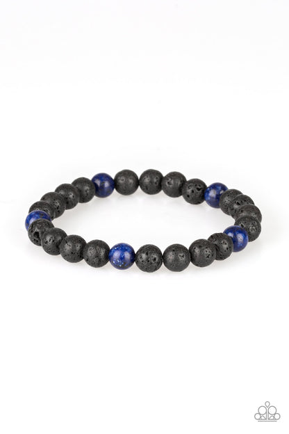 Enlivened - Blue Item #U43 An earthy collection of black lava stones and glassy blue stones are threaded along a stretchy band around the wrist for a seasonal look. All Paparazzi Accessories are lead free and nickel free!  Sold as one individual bracelet.