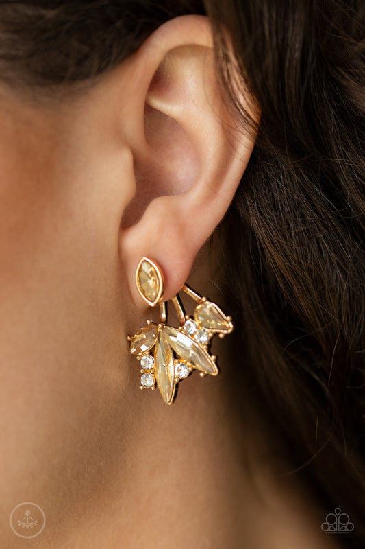 Deco Dynamite Gold Jacket Earring - Paparazzi Accessories  A solitaire golden marquise cut rhinestone attaches to a double-sided post, designed to fasten behind the ear. Encrusted in a collision of mismatched white and golden rhinestones, a double-sided post peeks out beneath the ear, creating a glittery fringe. Earring attaches to a standard post fitting. All Paparazzi Accessories are lead free and nickel free!  Sold as one pair of double-sided post earrings.