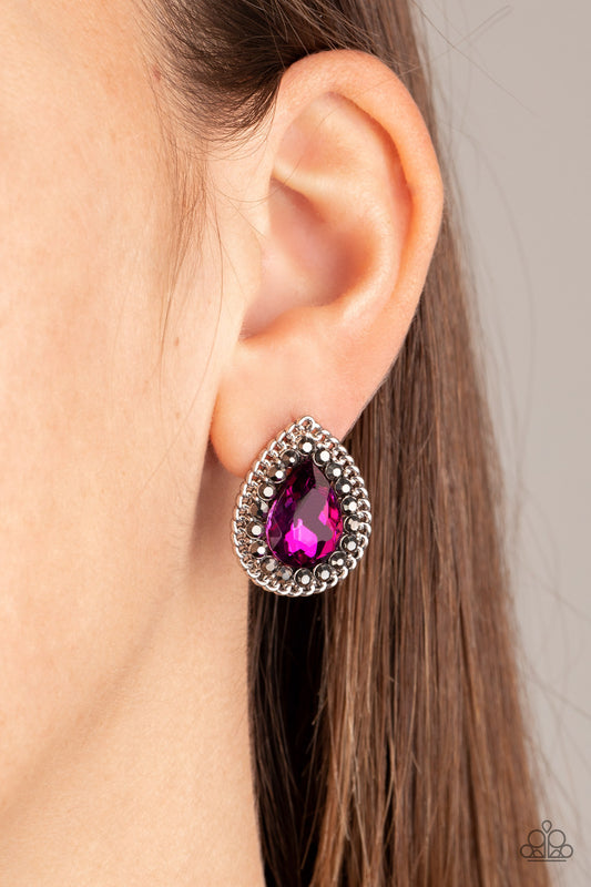 Debutante Debut Pink Earring - Paparazzi Accessories  A glittery pink teardrop gem is pressed into the center of a silver frame radiating with glittery hematite rhinestones. A chain of shimmery silver links border the sparkling center for an edgy elegance. Earring attaches to a standard post fitting. All Paparazzi Accessories are lead free and nickel free!  Sold as one pair of post earrings.