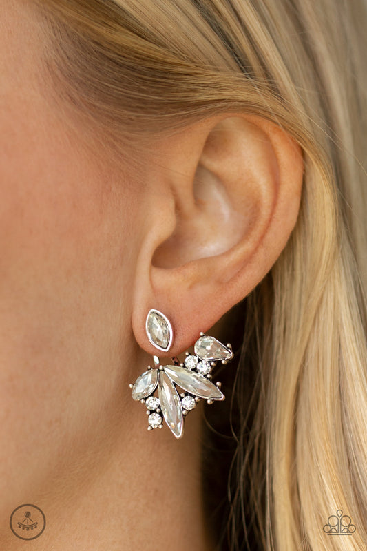 Deco Dynamite White Jacket Earring - Paparazzi Accessories  A solitaire white marquise cut rhinestone attaches to a double-sided post, designed to fasten behind the ear. Encrusted in a collision of mismatched white rhinestones, a double-sided post peeks out beneath the ear, creating a glittery fringe. Earring attaches to a standard post fitting.  ﻿All Paparazzi Accessories are lead free and nickel free!  Sold as one pair of double-sided post earrings.
