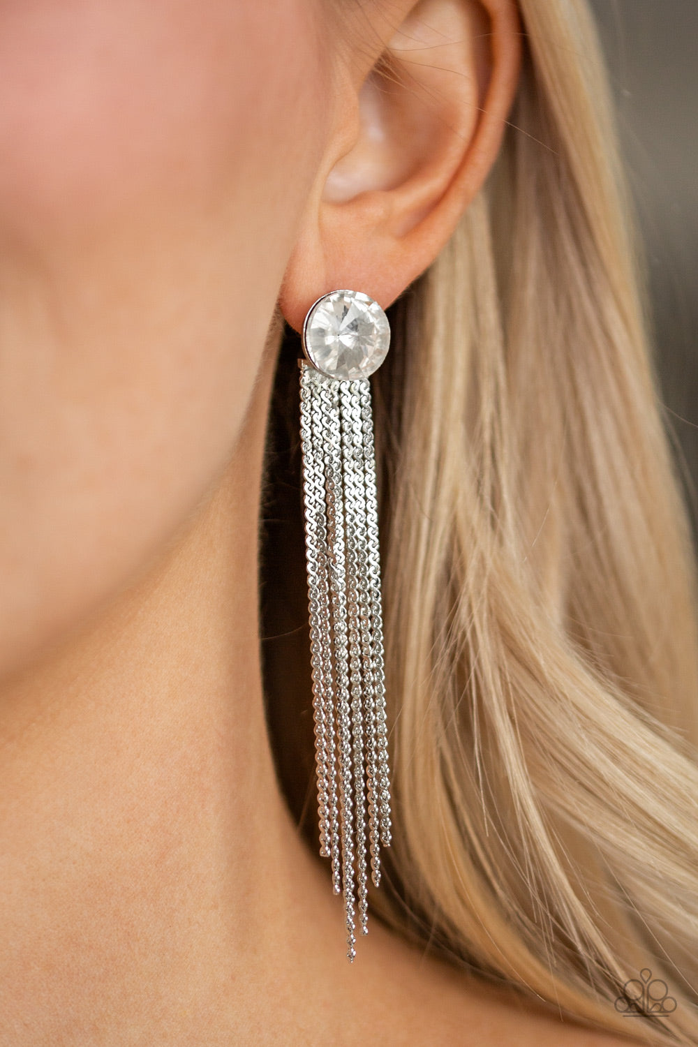 Level Up White Rhinestone Post Earring - Paparazzi Accessories  Flat silver chains stream from the bottom of a solitaire white gem, creating a dramatically tapered fringe. Earring attaches to a standard post fitting.  Sold as one pair of post earrings.