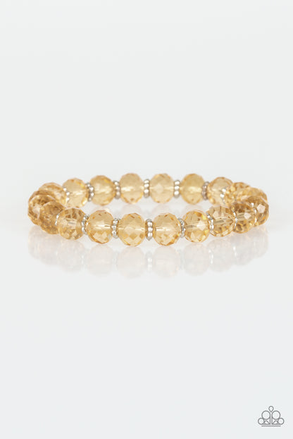 Crystal Candelabras Gold Bracelet - Paparazzi Accessories  Glittery crystal-like beads and studded silver rings are threaded along a stretchy band around the wrist for a sophisticated look.  All Paparazzi Accessories are lead free and nickel free!  Sold as one individual bracelet.