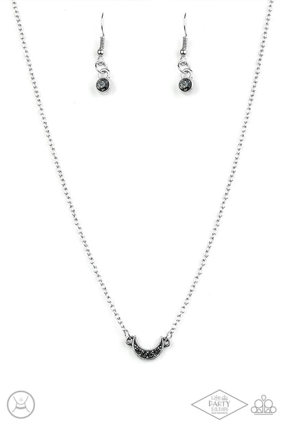 Promise The Moon Silver Choker Necklace - Paparazzi Accessories  Encrusted in smoky rhinestones, a dainty silver half-moon frame attaches to a dainty shimmery chain around the neck for a minimalist inspired fashion. Features an adjustable clasp closure.  Sold as one individual choker necklace. Includes one pair of matching earrings. This Fan Favorite is back in the spotlight at the request of our 2021 Life of the Party member with Black Diamond Access, Lindsay K.