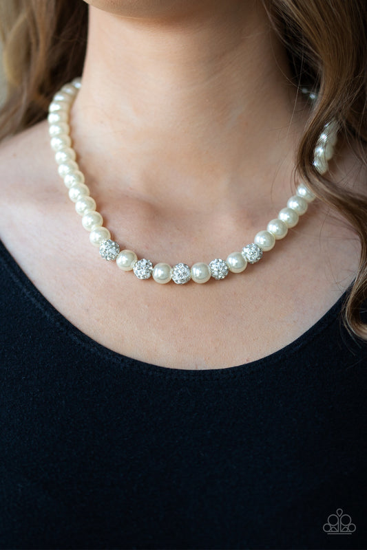 Posh Boss White Pearl Necklace - Paparazzi Accessories.  Infused with glittery rhinestone encrusted beads, a classic strand of white pearls drapes below the collar in a timeless fashion. Features an adjustable clasp closure.  ﻿﻿﻿All Paparazzi Accessories are lead free and nickel free!  Sold as one individual necklace. Includes one pair of matching earrings.  Get The Complete Look! Bracelet: "POSHing Your Luck - White" (Sold Separately)
