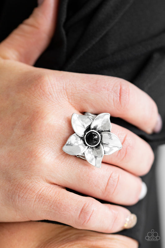 Ask For Flowers Black Ring - Paparazzi Accessories  Glistening silver petals fold around a shiny black beaded center, creating a whimsical flower atop the finger. Features a stretchy band for a flexible fit.  All Paparazzi Accessories are lead free and nickel free!  Sold as one individual ring.