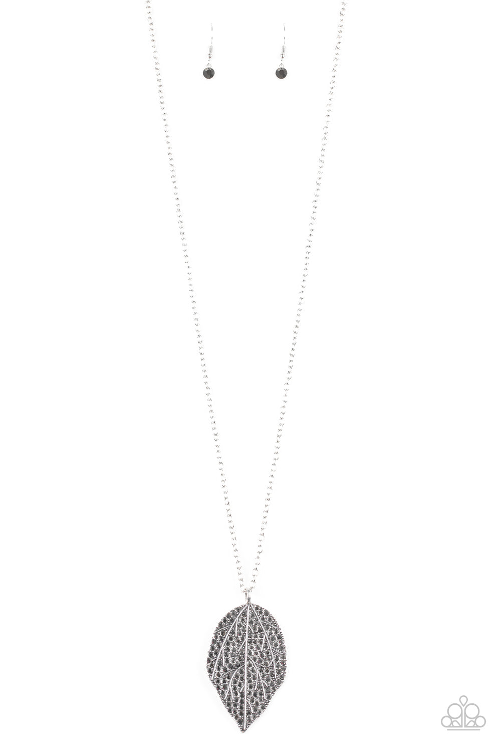 Natural Re-LEAF Silver Necklace - Paparazzi Accessories. Featuring lifelike patterns, a hematite rhinestone encrusted silver leaf swings from the bottom of a lengthened silver chain, creating an edgy pendant. Features an adjustable clasp closure.  All Paparazzi Accessories are lead free and nickel free!  Sold as one individual necklace. Includes one pair of matching earrings.