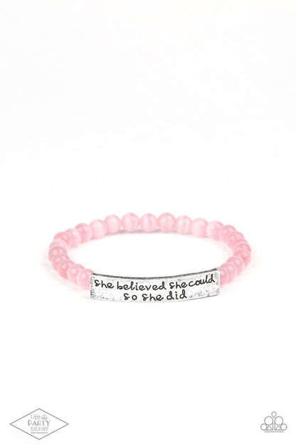 So She Did Pink Bracelet - Paparazzi Accessories  A collection of dainty pink cat’s eye stone beads and an antiqued frame stamped in the inspirational phrase, “She believed she could, so she did,” are threaded along a stretchy band around the wrist for a whimsical fashion.  Sold as one individual bracelet. This Fan Favorite is back in the spotlight at the request of our 2021 Life of the Party member with Black Diamond Access, Angela D.