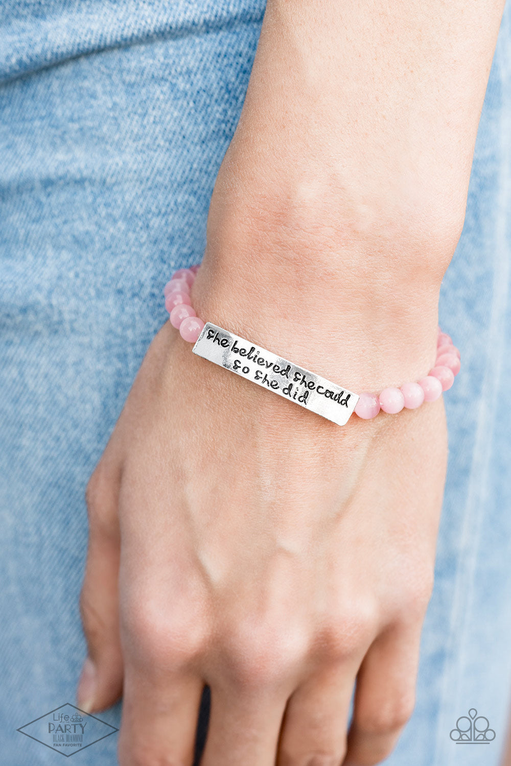 So She Did Pink Bracelet - Paparazzi Accessories  A collection of dainty pink cat’s eye stone beads and an antiqued frame stamped in the inspirational phrase, “She believed she could, so she did,” are threaded along a stretchy band around the wrist for a whimsical fashion.  Sold as one individual bracelet. This Fan Favorite is back in the spotlight at the request of our 2021 Life of the Party member with Black Diamond Access, Angela D.