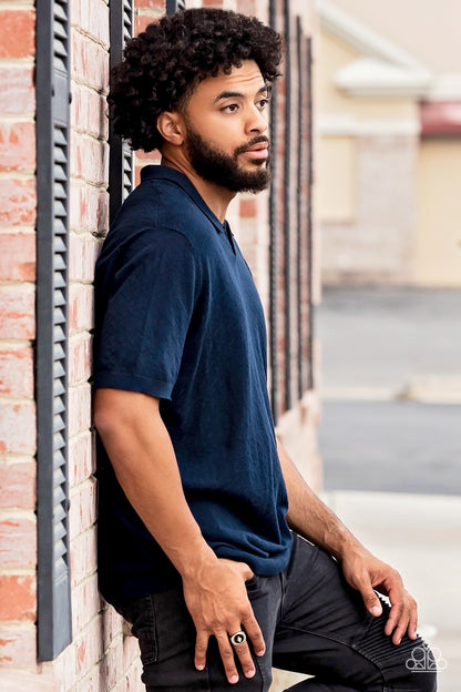 Alumni Black Urban Ring - Paparazzi Accessories   A solitaire white rhinestone is pressed into the center of a gold diamond-shaped frame that sits atop a painted black backdrop. Features a stretchy band for a flexible fit.  Sold as one individual ring.