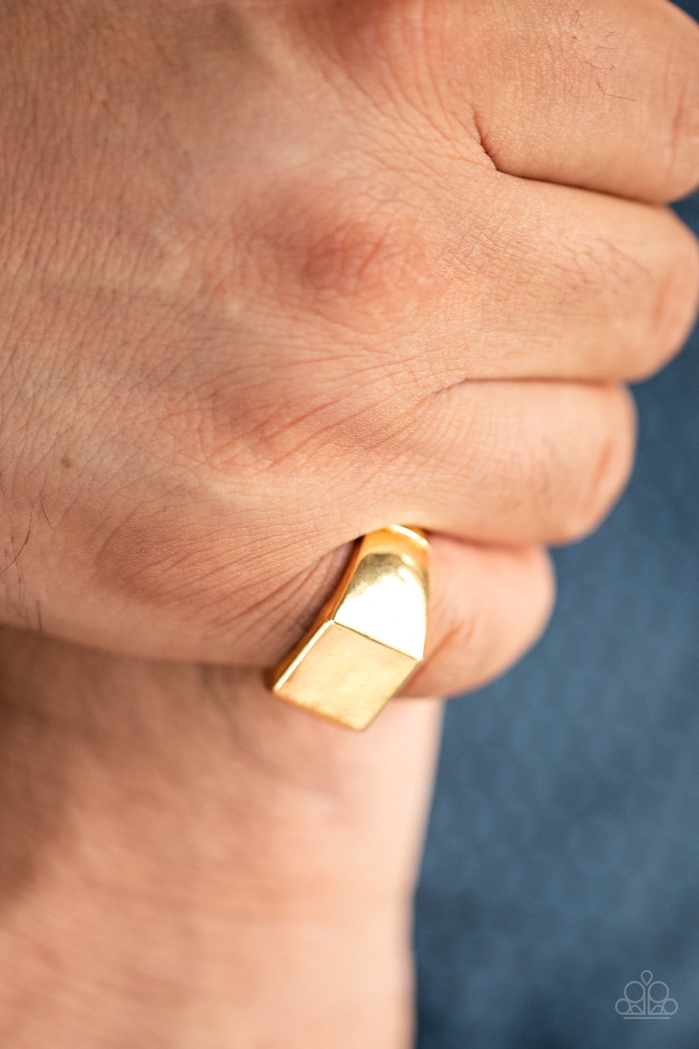 Void Gold Urban Ring - Paparazzi Accessories  The center of a thick gold band has been smashed into a flat square center for a casual look. Features a shortened stretchy band for a flexible fit. Intended to be worn on the pinky finger.  Sold as one individual ring.