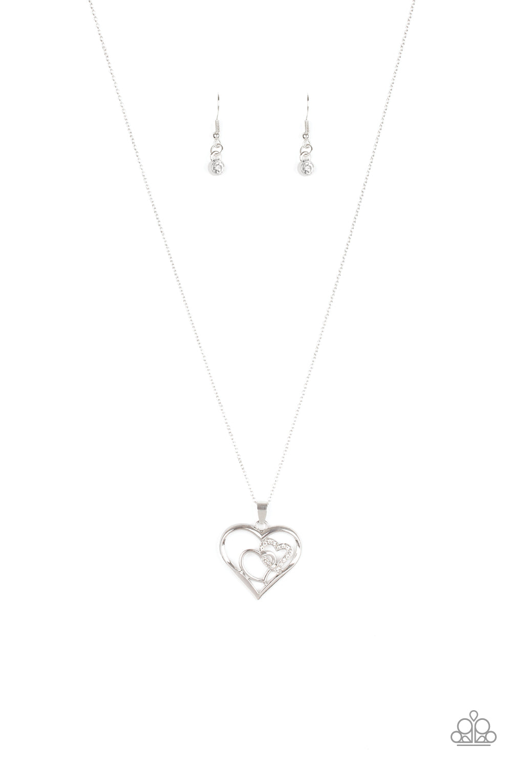 Cupid Charm White Necklace - Paparazzi Accessories  A white rhinestone encrusted heart intertwines with a plain silver heart inside of a larger silver heart frame, creating a romantic pendant at the bottom of a shimmery silver chain. Features an adjustable clasp closure.  All Paparazzi Accessories are lead free and nickel free!   Sold as one individual necklace. Includes one pair of matching earrings.