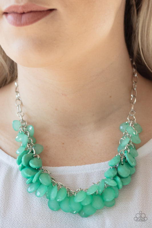 Colorfully Clustered Green Necklace - Paparazzi Accessories  A minty green collection of polished and crystal-like teardrop beads cluster along the bottom of a shimmery silver chain, creating a flirtatious fringe below the collar. Features an adjustable clasp closure.   All Paparazzi Accessories are lead free and nickel free!  Sold as one individual necklace. Includes one pair of matching earrings.