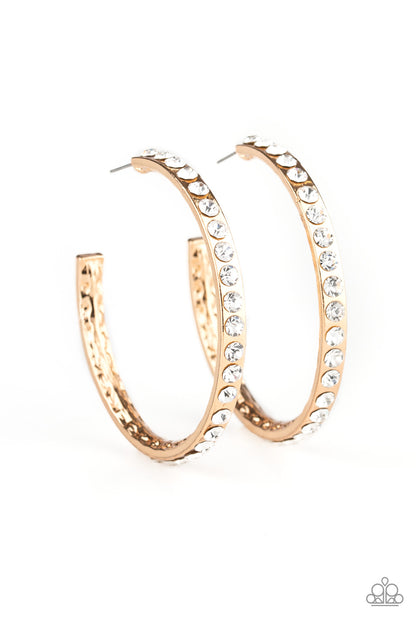 Global Gleam - Gold Item #P5HO-GDXX-135XX The outside of a delicately hammered gold hoop is encrusted in glassy white rhinestones for a blinding look. Earring attaches to a standard post fitting. Hoop measures approximately 2" in diameter.  Sold as one pair of hoop earrings.