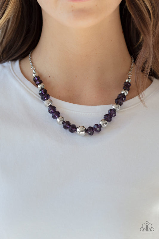 Jewel Jam Purple Necklace - Paparazzi Accessories  A glittery collection of purple crystal-like beads and shiny silver beads are threaded along an invisible wire below the collar for a refined flair. Features an adjustable clasp closure.  Sold as one individual necklace. Includes one pair of matching earrings.