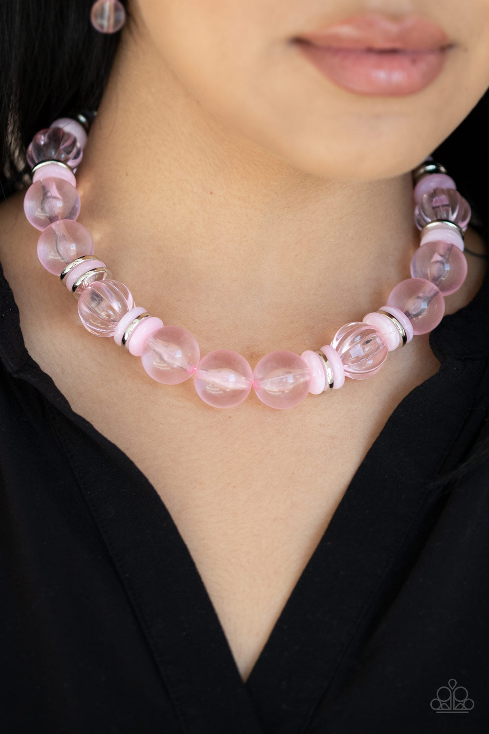 Bubbly Beauty Pink Necklace - Paparazzi Accessories  Featuring dainty silver and pink acrylic discs, a collection of oversized glassy pink beads are threaded along an invisible wire below the collar for a colorfully bubbly look. Features an adjustable clasp closure.  All Paparazzi Accessories are lead free and nickel free!  Sold as one individual necklace. Includes one pair of matching earrings.