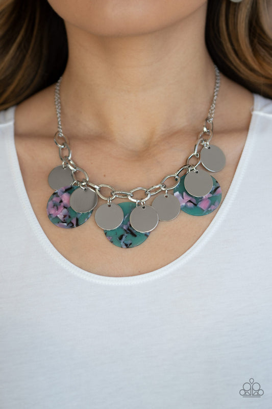 Confetti Confection Blue Necklace - Paparazzi Accessories  Attached to doubled silver chain, a playful collection of colorful acrylic discs and shiny silver discs swing from the bottom of a bold silver chain, creating a bubbly fringe below the collar. Features an adjustable clasp closure. Color may vary.   All Paparazzi Accessories are lead free and nickel free!  Sold as one individual necklace. Includes one pair of matching earrings.