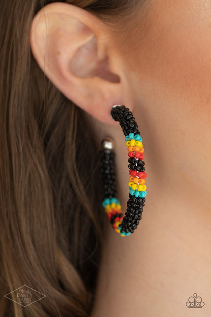 Bodaciously Beaded Black Hoop Earring - Paparazzi Accessories  A colorful strand of black, blue, yellow, orange, and red seed beads wraps around a shiny silver hoop, creating a colorfully seasonal look. Earring attaches to a standard post fitting. Hoop measures approximately 2" in diameter.  All Paparazzi Accessories are lead free and nickel free!  Sold as one pair of hoop earrings. This Fan Favorite is back in the spotlight!