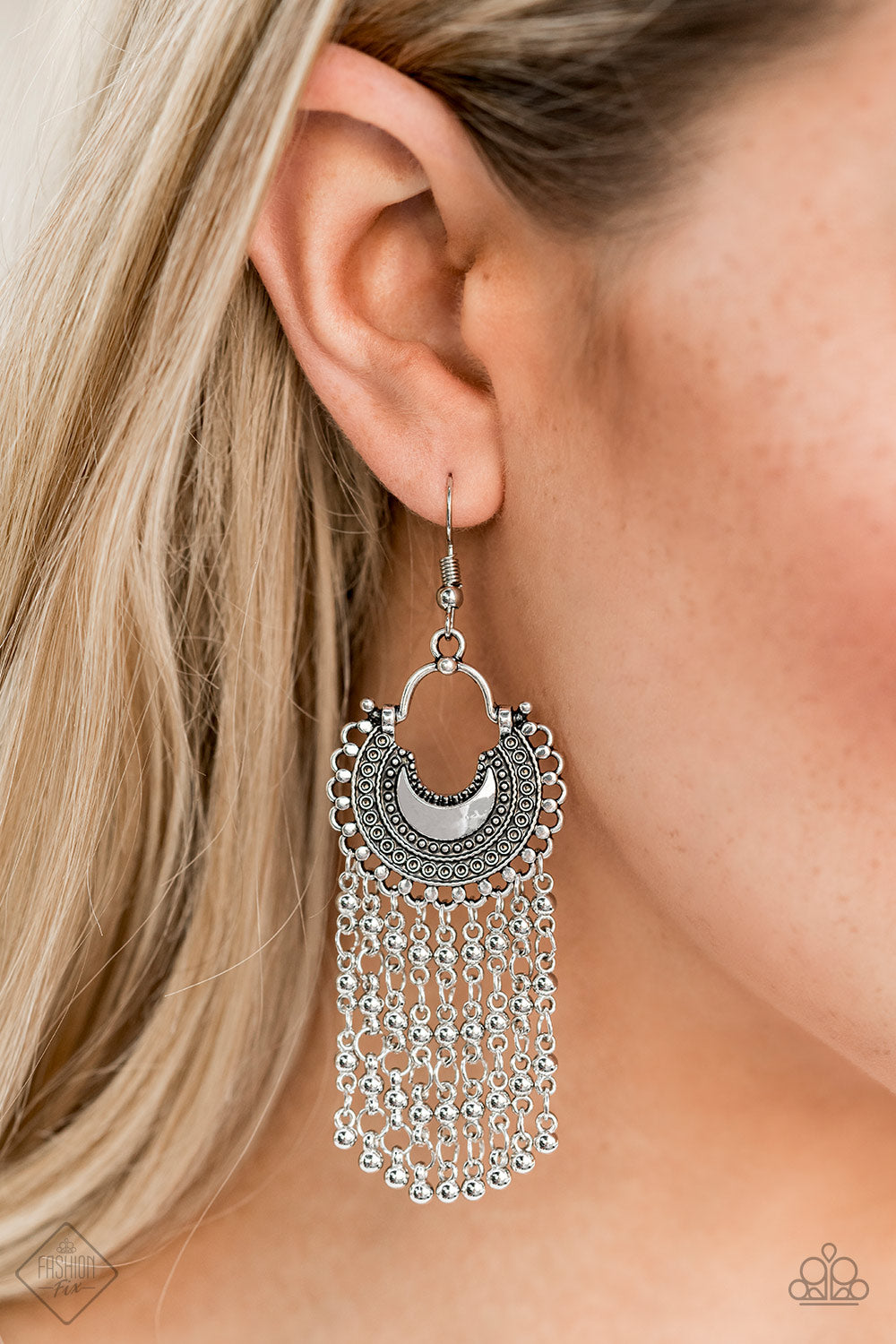 Catching Dreams Silver Earring - Paparazzi Accessories Item #E148 Beaded silver chains stream from the bottom of a textured half-moon silver frame, creating a dreamy fringe. Earring attaches to a standard fishhook fitting. All Paparazzi Accessories are lead free and nickel free!  Sold as one pair of earrings.