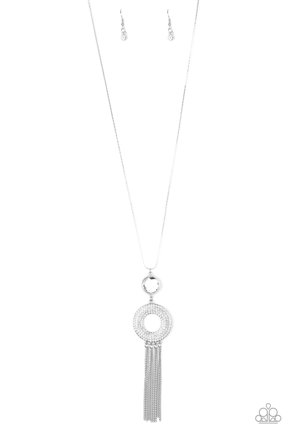 Sassy As They Come White Necklace - Paparazzi Accessories Item #N659 An oversized white gem attaches to a thick silver hoop encrusted in row after row of dazzling white rhinestones. Shimmery silver chains stream from the bottom of the stacked pendant at the bottom of a lengthened flat silver chain, creating a sassy tassel. Features an adjustable clasp closure. All Paparazzi Accessories are lead free and nickel free!  Sold as one individual necklace. Includes one pair of matching earrings.