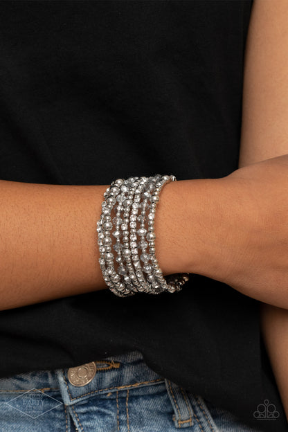 ICE Knowing You Silver Bracelet - Paparazzi Accessories  An icy collection of silver beads, silver cubes, metallic crystals, and glassy white rhinestones are threaded along a coiled wire, creating a blinding infinity wrap style bracelet around the wrist.  All Paparazzi Accessories are lead free and nickel free!  Sold as one individual bracelet.