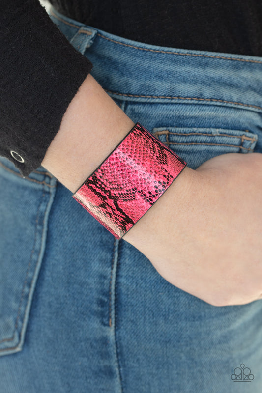 Its a Jungle Out There Pink Animal Print Wrap Bracelet - Paparazzi Accessories  Featuring neon pink python print, a thick leather band wraps around the wrist for a colorfully wild look. Features an adjustable snap closure.  Sold as one individual bracelet.  SKU: P9SE-URPK-088XX