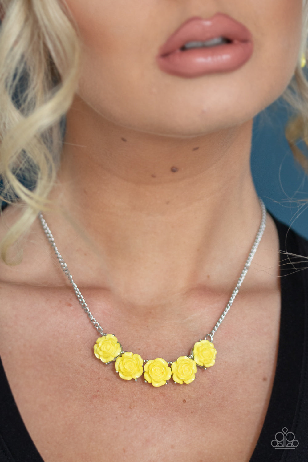 Garden Party Posh Yellow Necklace - Paparazzi Accessories Attached to a shimmery silver chain, a dainty collection of yellow resin roses collect beneath the collar for a whimsical look. Features an adjustable clasp closure. ﻿All Paparazzi Accessories are lead free and nickel free! Sold as one individual necklace. Includes one pair of matching earrings.
