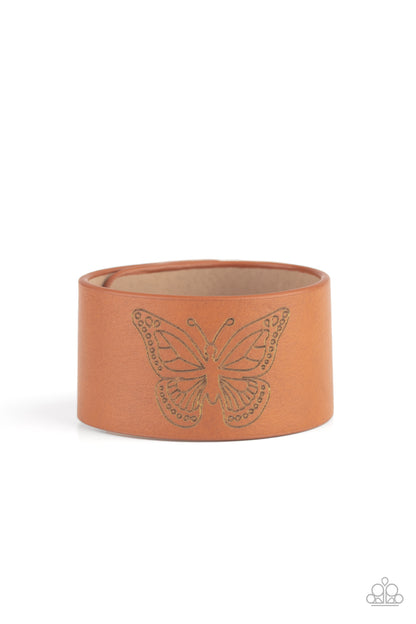 Flirty Flutter Brown Wrap Bracelet - Paparazzi Accessories Stamped in a whimsical butterfly, a rustic piece of brown leather wraps around the wrist for a seasonal flair. Features an adjustable snap closure.   All Paparazzi Accessories are lead free and nickel free!  Sold as one individual bracelet.
