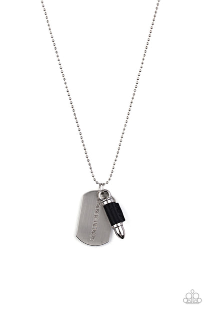 Proud Patriot Black Necklace - Paparazzi Accessories  Pinched between a black leather fitting, a silver bullet pendant joins a silver dog tag at the bottom of a silver ball chain. The shimmery dog tag is stamped in the phrase, "Because of the Brave," for a patriotic finish. Features a ball and clasp closure.  Sold as one individual necklace.  P2MN-URBK-057XX
